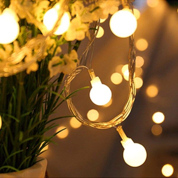 Enhance your indoor and outdoor ambiance with ZOUTOG Battery Operated String Lights. This 33ft string features 100 warm white LED lights on a durable wire, perfect for dark corners or tree decoration. With a remote control for easy operation, adjust brightness and choose from 8 flashing modes. The water-resistant design allows for versatile use, creating a warm and romantic atmosphere in your garden, yard, or any space you desire. Trust in ZOUTOG for energy-efficient and long-lasting LED lights, backed by a one-year guarantee.